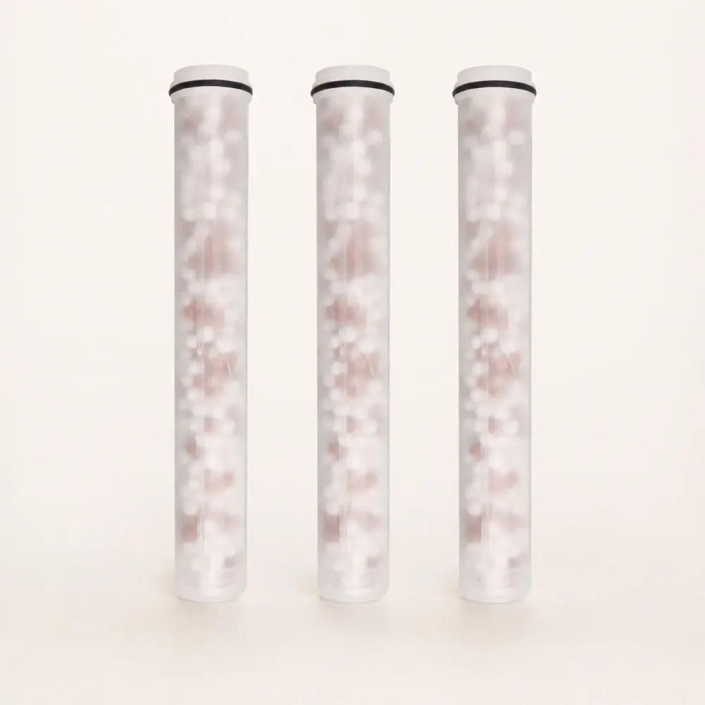 Three replacement filter cartridges standing side by side